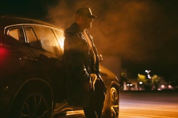 man sitting car night 23 2149001291