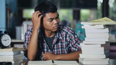 educational conept tired student library e1745997282704